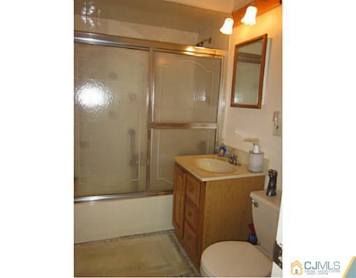 50 Gurley Road Edison, NJ 08817 - Photo 10 of 10 a bathroom with a sink toilet and shower