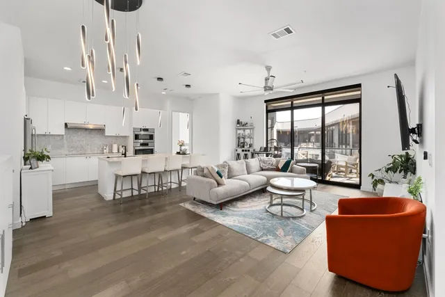 a living room with furniture and a large window