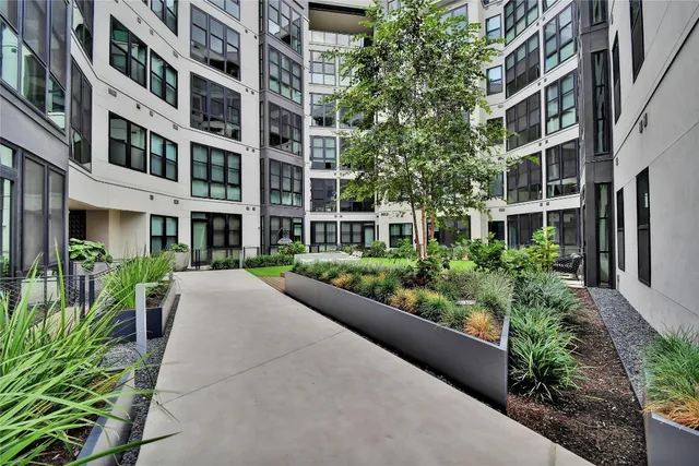a view of a building with a garden