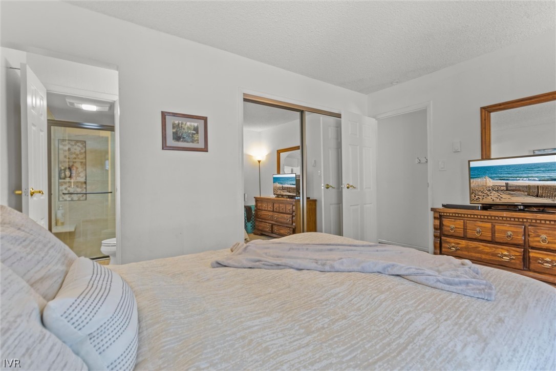 321 Ski Way, Unit 13 Incline Village, NV 89451 - Photo 11 of 26 a bedroom with a bed and a dresser