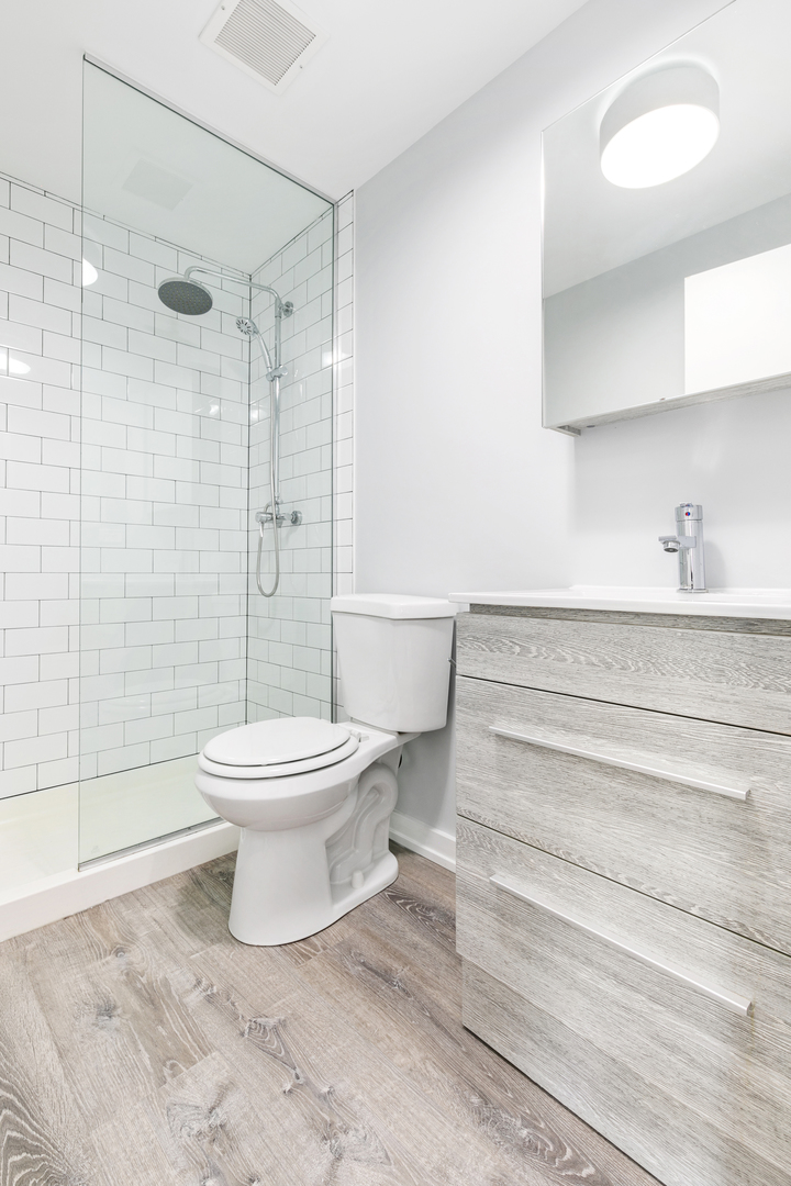 4875 North Magnolia Avenue, Unit 302 Chicago, IL 60640 - Photo 6 of 8 a bathroom with a toilet and a shower