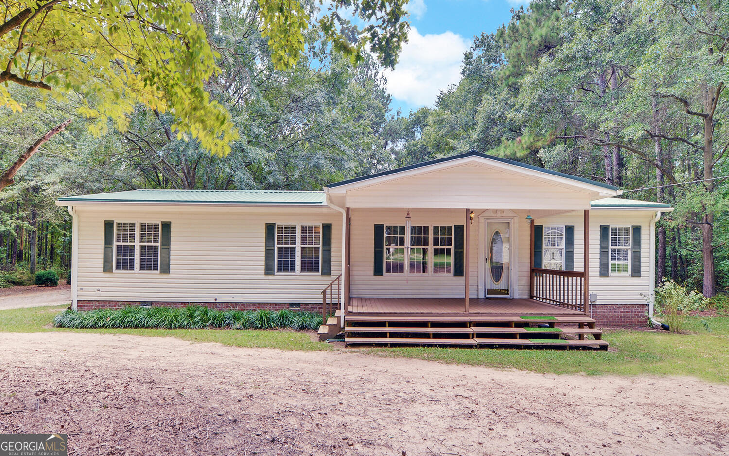 711 Mewborn Road Dewy Rose, GA 30634 - Photo 1 of 1 a front view of a house with garden