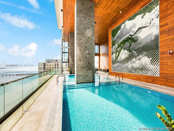 a view of swimming pool with a chairs