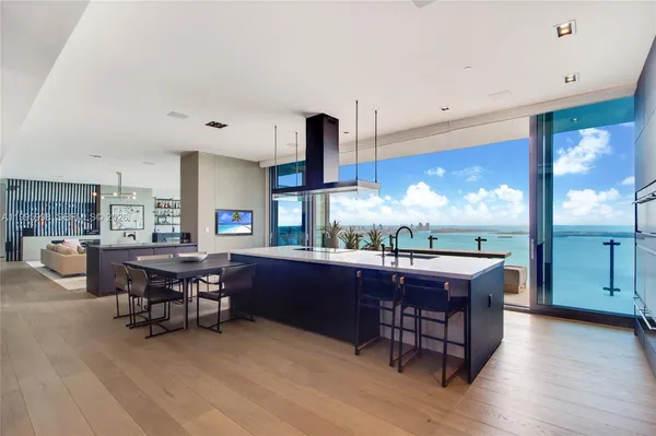 a kitchen with a table and chairs in it
