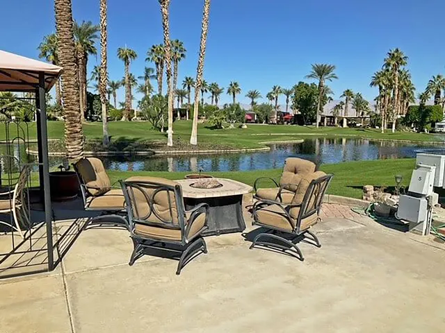 a view of a lake with outdoor seating