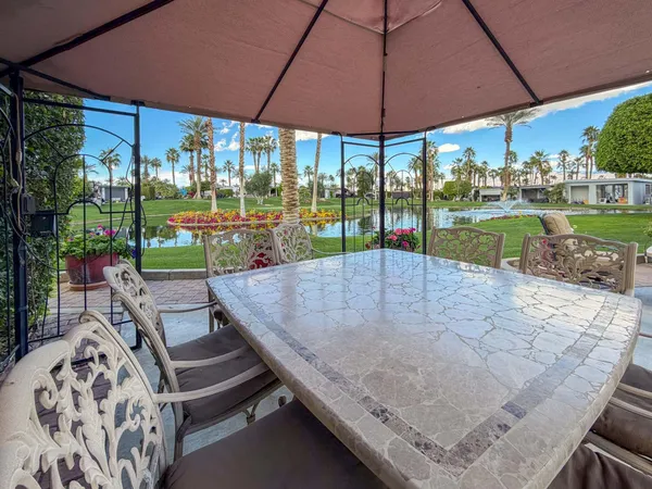 a view of swimming pool with a patio
