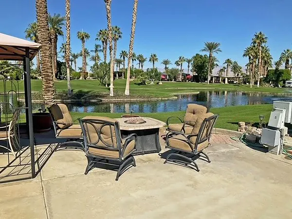 a view of a lake with outdoor seating