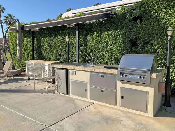 a backyard of a house with yard and outdoor seating
