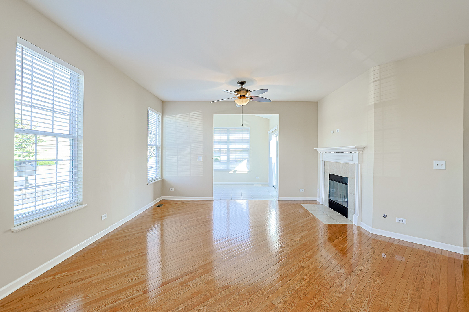 8800 Templeton Road Huntley, IL 60142 - Photo 11 of 31 wooden floor in an empty room with a window