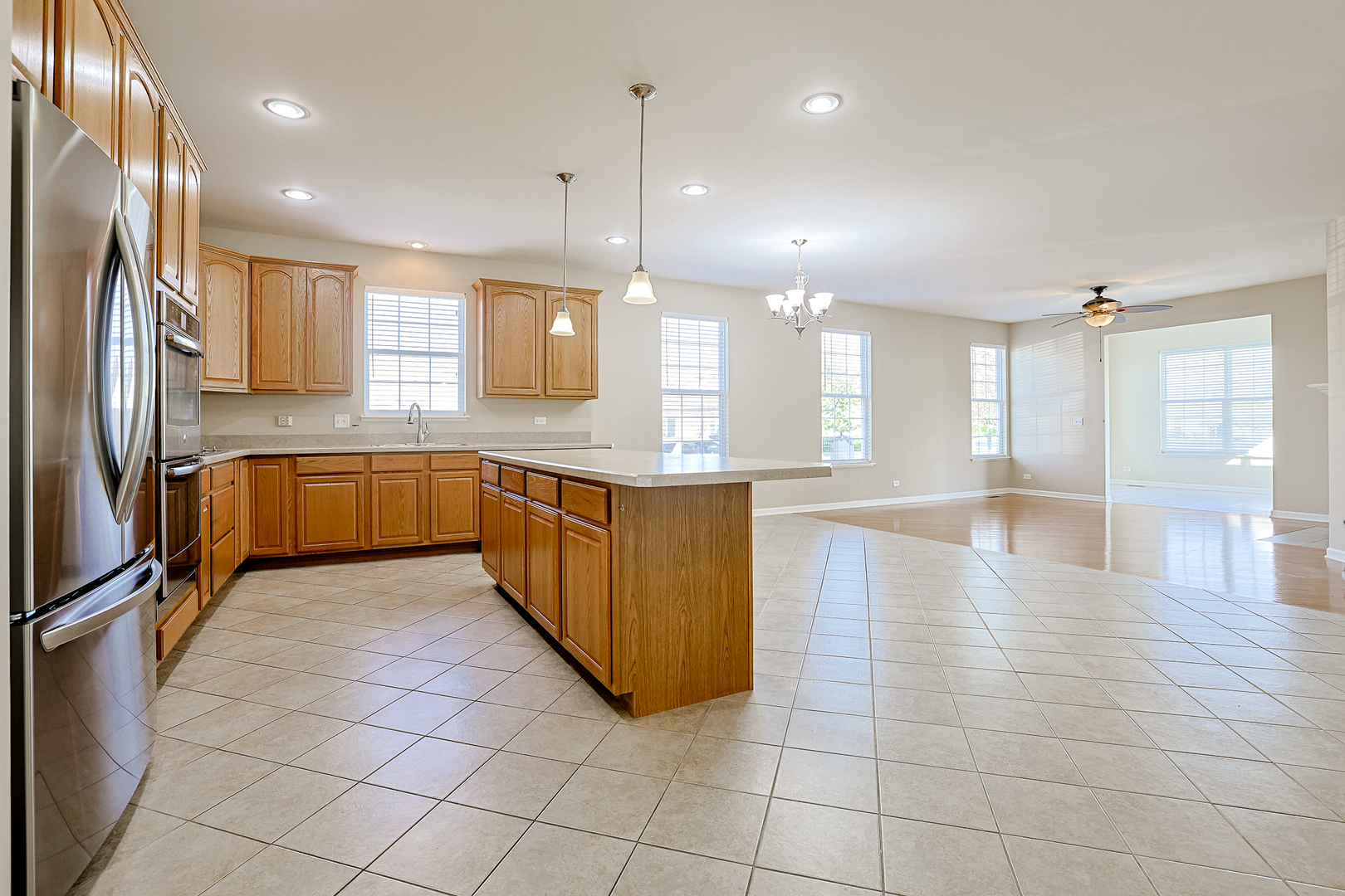 8800 Templeton Road Huntley, IL 60142 - Photo 4 of 31 a large kitchen with stainless steel appliances lots of counter top space