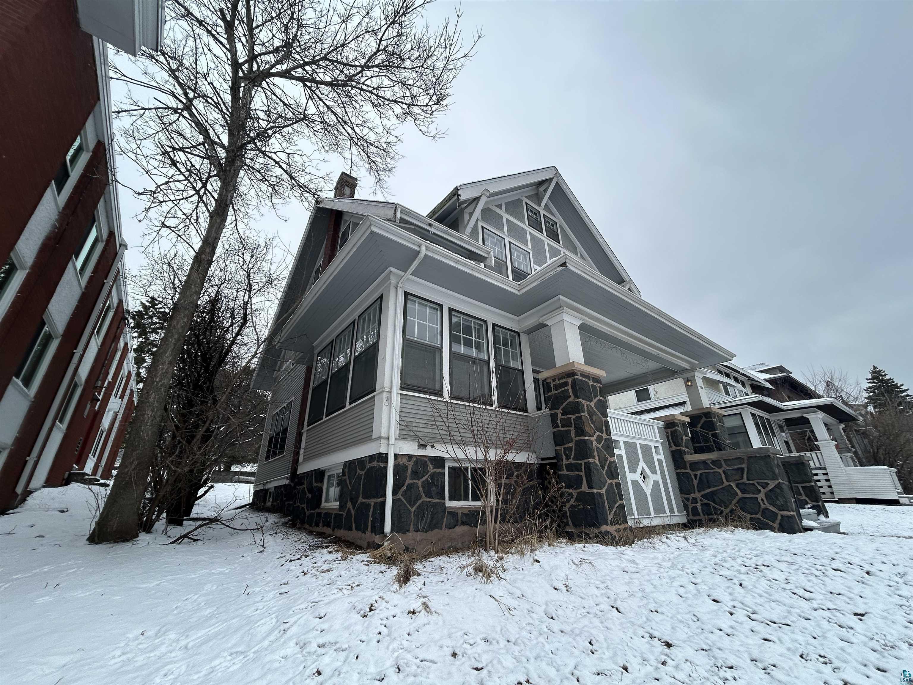 1723 East 4th Street Duluth, MN 55812 - Photo 2 of 47 View of front of home featuring a sunroom and a chimney
