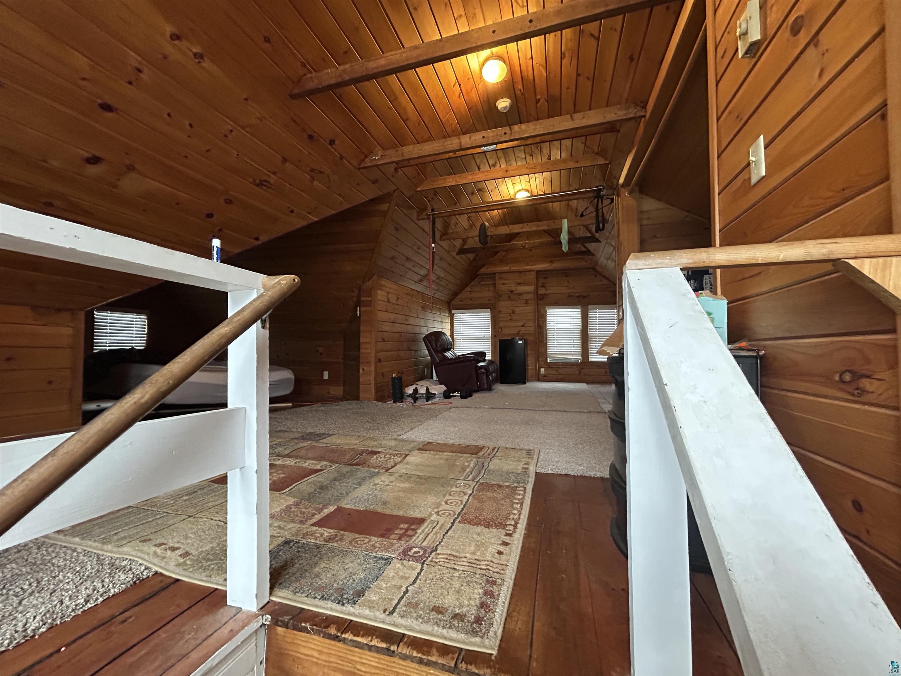 1723 East 4th Street Duluth, MN 55812 - Photo 21 of 47 Bonus room with wooden walls, wood-type flooring, and wooden ceiling