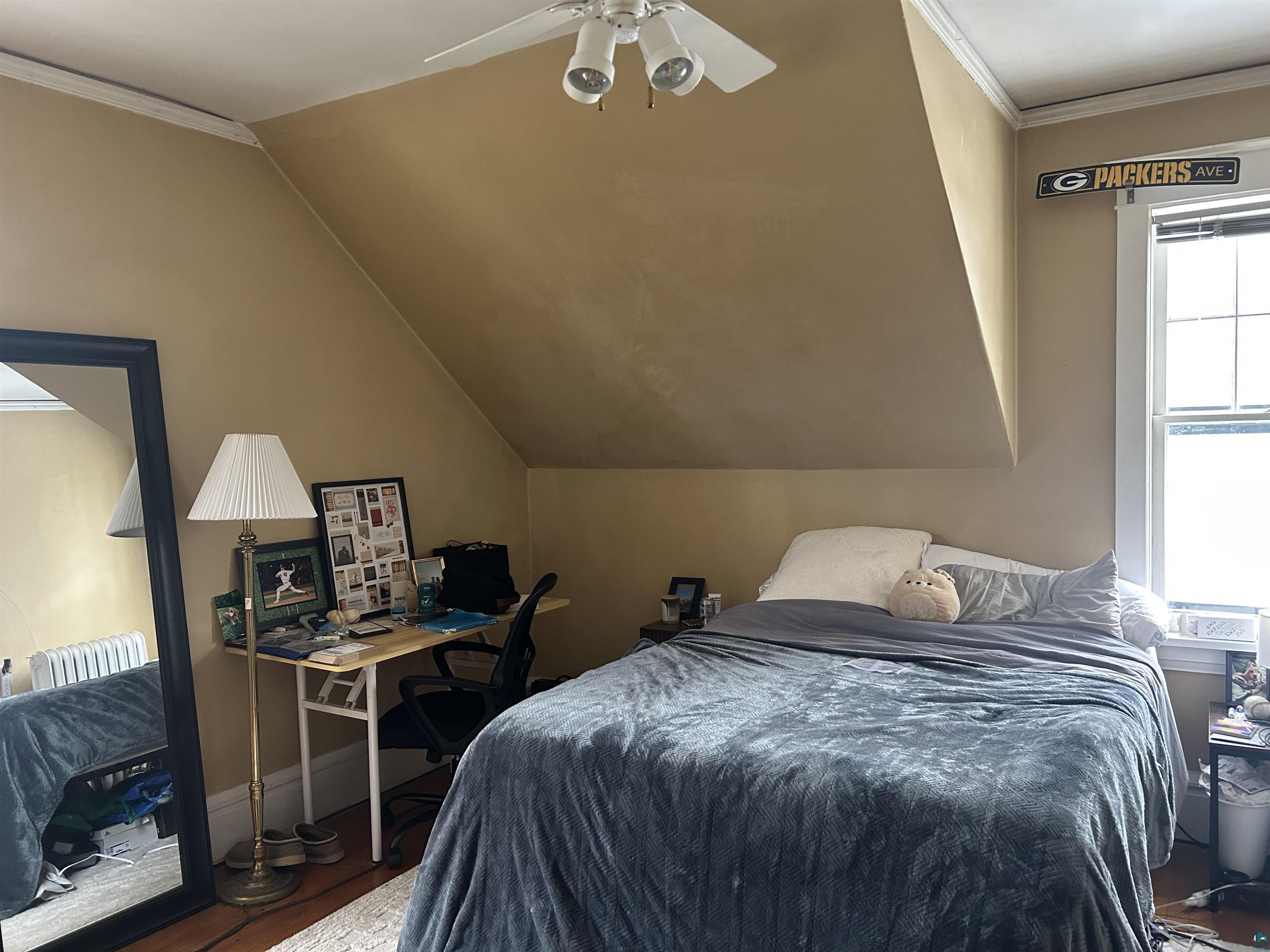 1723 East 4th Street Duluth, MN 55812 - Photo 25 of 47 Bedroom with crown molding, an office area, wood finished floors, ceiling fan, and lofted ceiling