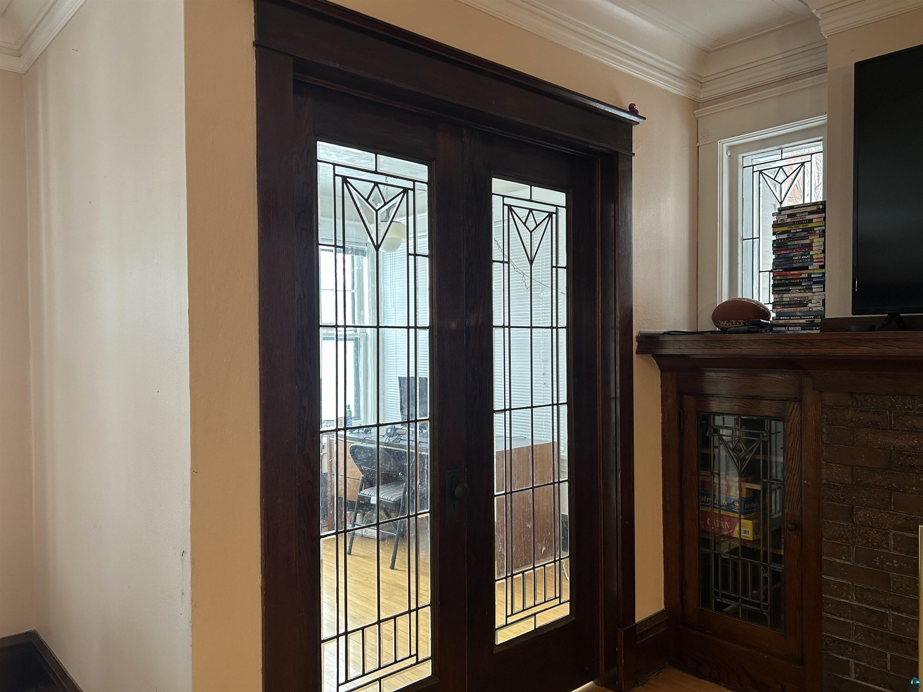 1723 East 4th Street Duluth, MN 55812 - Photo 43 of 47 Doorway to outside featuring crown molding and wood finished floors