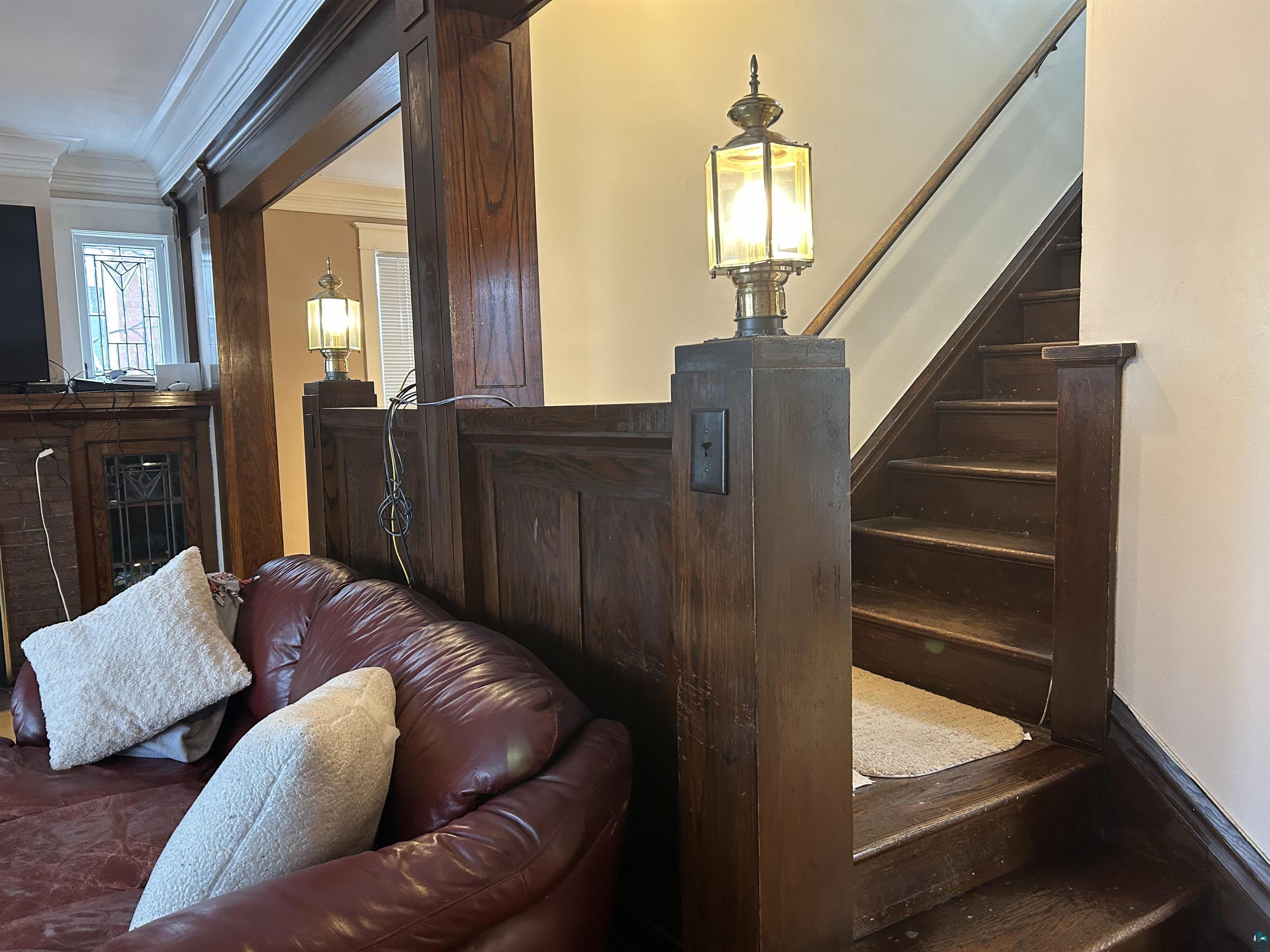 1723 East 4th Street Duluth, MN 55812 - Photo 45 of 47 Stairway featuring crown molding