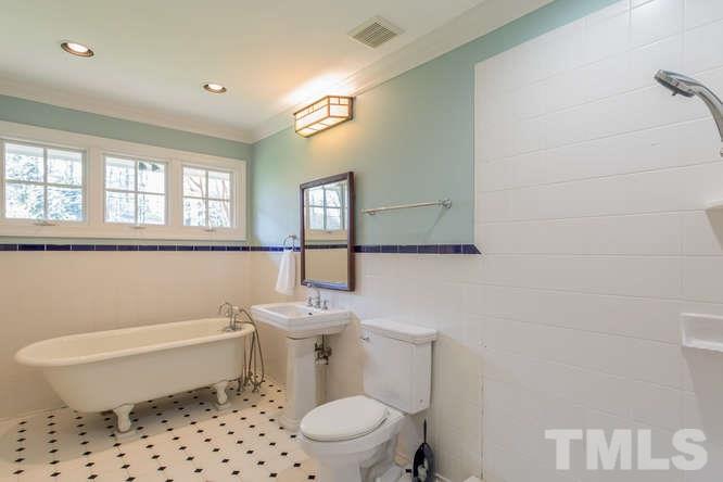 906 Runnymede Road Raleigh, NC 27607 - Photo 22 of 25 a bathroom with a toilet a sink and a mirror