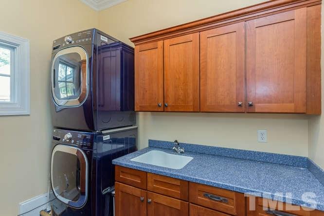 906 Runnymede Road Raleigh, NC 27607 - Photo 24 of 25 a bathroom with a sink and a mirror