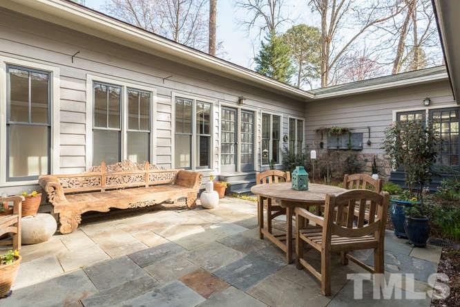 906 Runnymede Road Raleigh, NC 27607 - Photo 6 of 25 a view of a house with backyard and sitting area