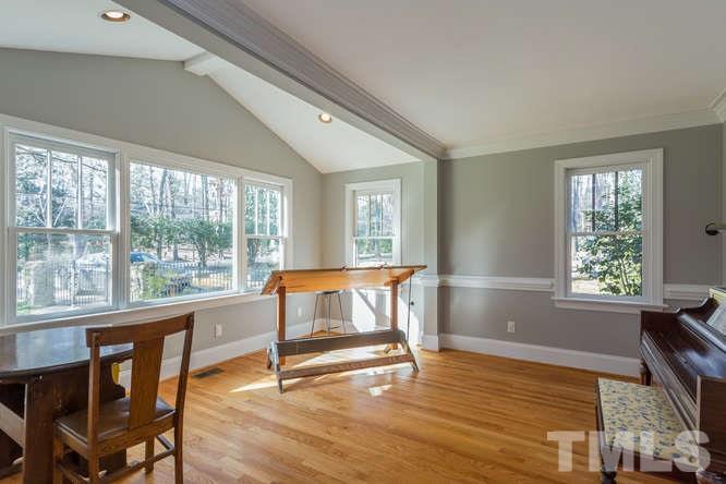 906 Runnymede Road Raleigh, NC 27607 - Photo 10 of 25 a view of a workspace with furniture and a window