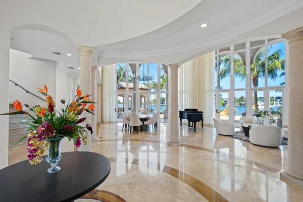a view of a dining room with furniture and chandelier