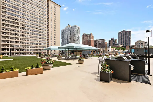 a view of a swimming pool and lounge chairs