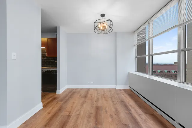 a view of an empty room with a window