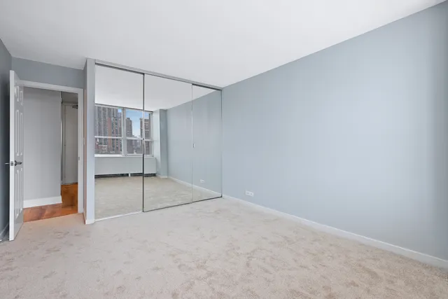 an empty room with a empty space and windows