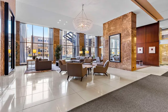 a living room with furniture large window and flat screen tv