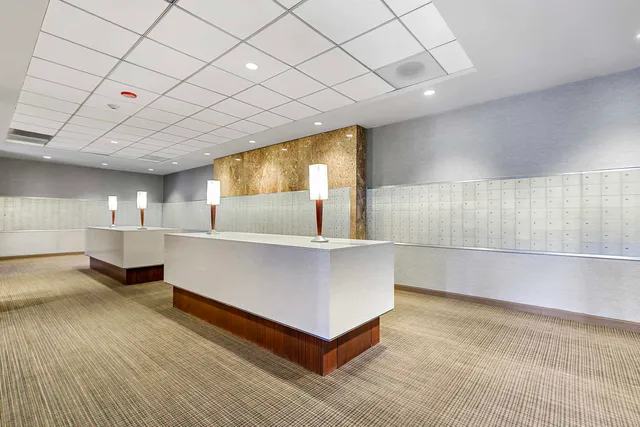 a living room with granite countertop furniture and a flat screen tv
