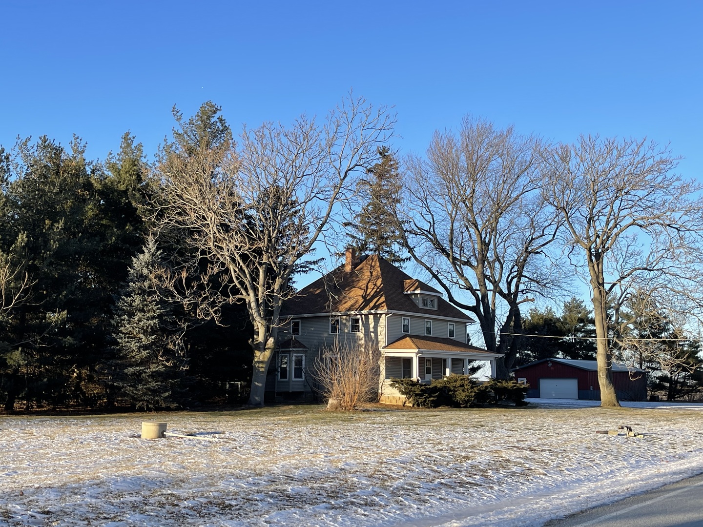 a view of a house with a snow in front of a house