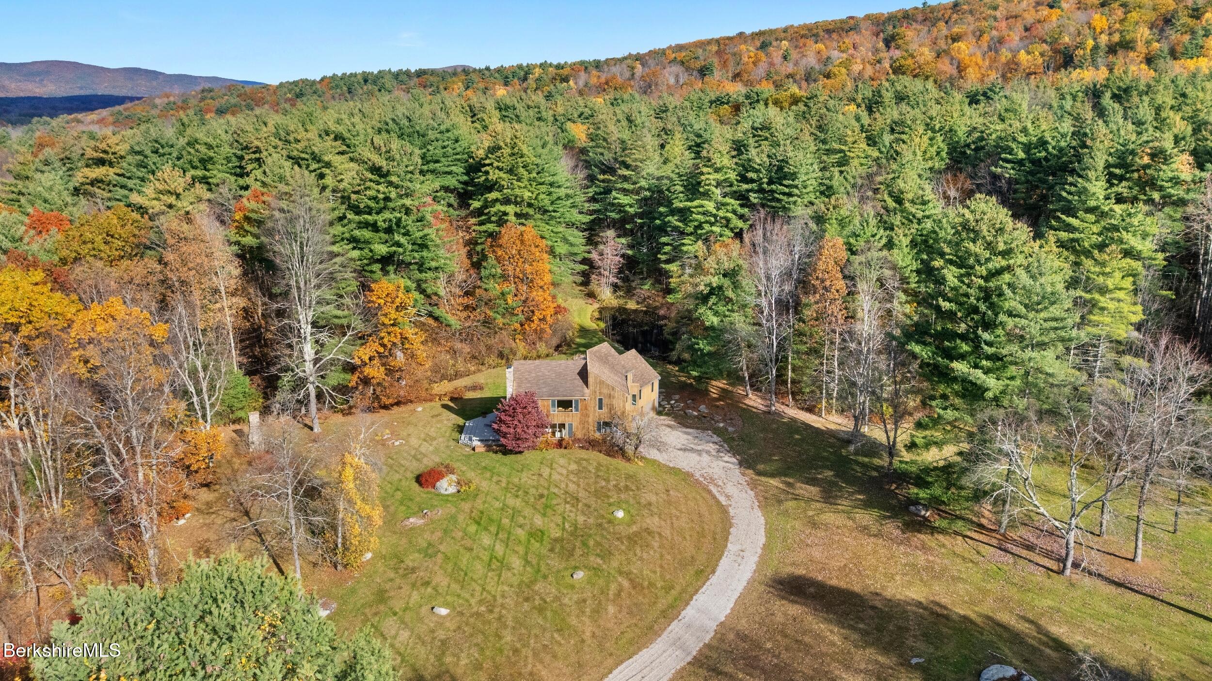 a view of a swimming pool with a yard