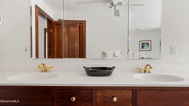 a bath tub sitting in a bathroom next to a window