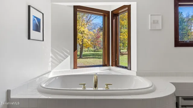 a bathroom with a bathtub and shower