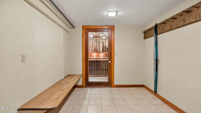 a view of a lake with a bench and trees