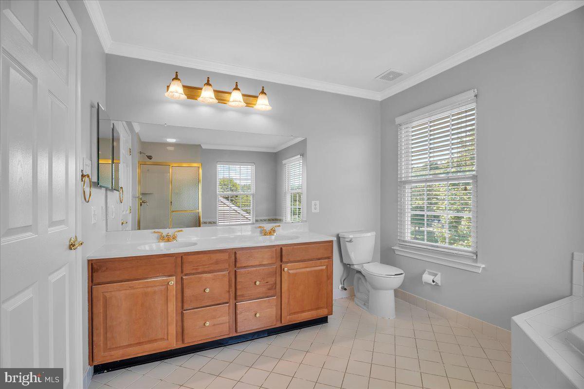 68 Hillside Lane Mount Laurel, NJ 08054 - Photo 27 of 36 a bathroom with a double vanity sink a toilet and a mirror