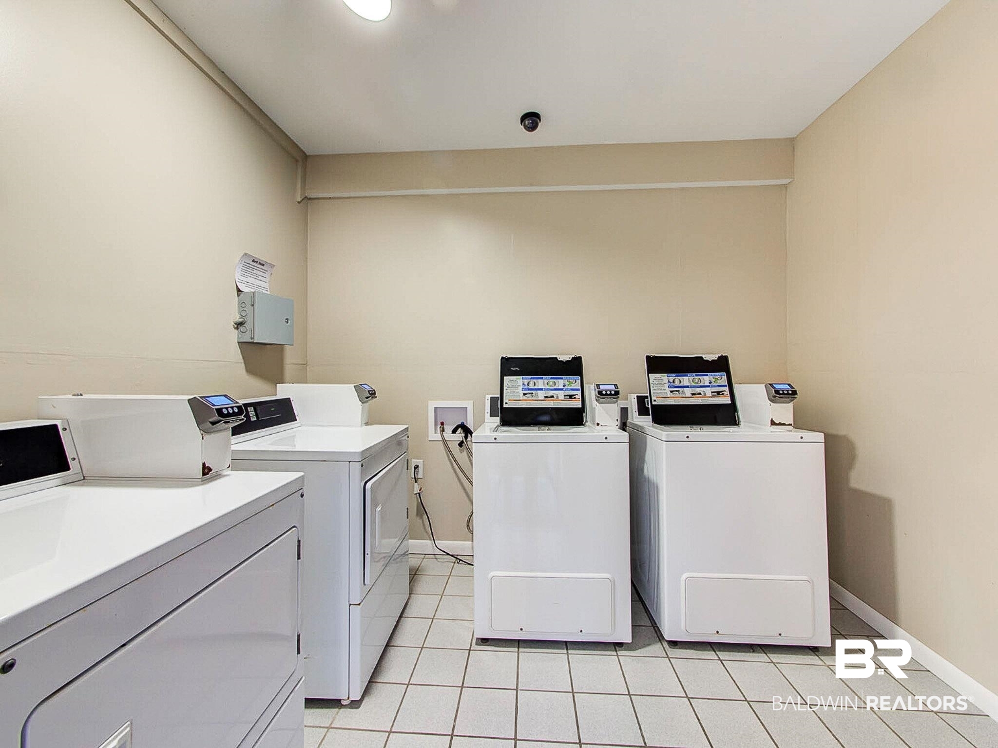400 Plantation Road, Unit 4115 Gulf Shores, AL 36542 - Photo 46 of 48 Clothes washing area featuring light tile patterned floors and independent washer and dryer