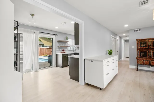 a stove top oven sitting inside of a kitchen