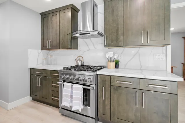 a kitchen with refrigerator and a sink