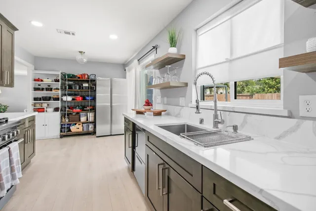 a living room with furniture a rug and a table