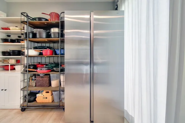 a spacious bedroom with a bed and a fireplace