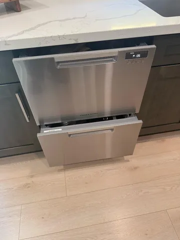 a living room with a bed furniture and a fireplace