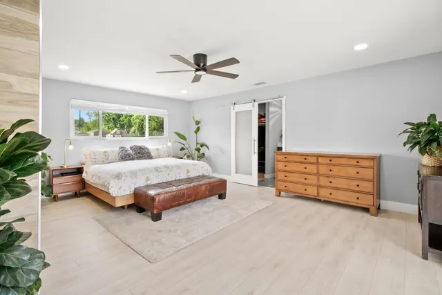 a bed room with a bed and a window