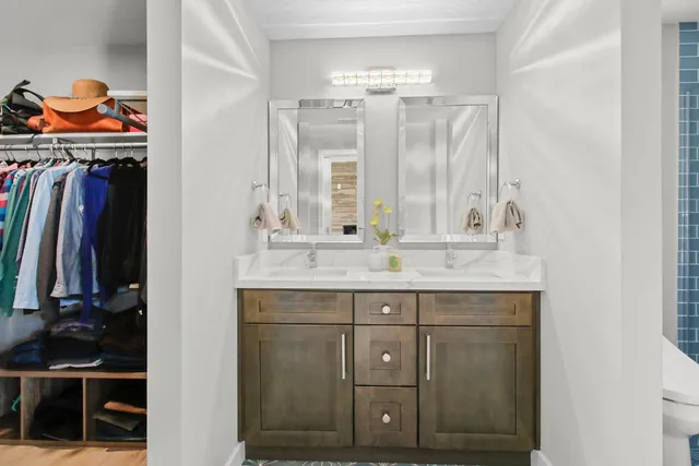 a bathroom with a sink and a mirror