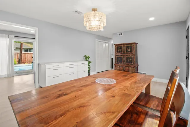 a kitchen with stainless steel appliances granite countertop a stove and a sink
