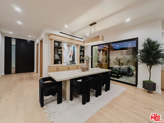 a view of a room with furniture and window