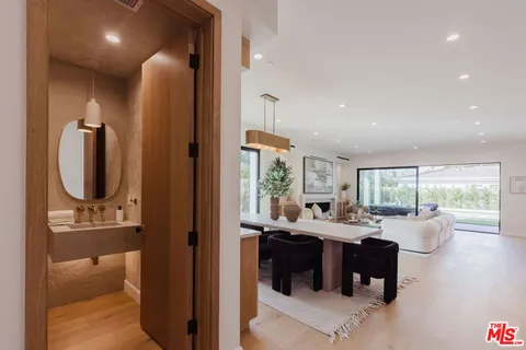 a kitchen with a table and chairs in it