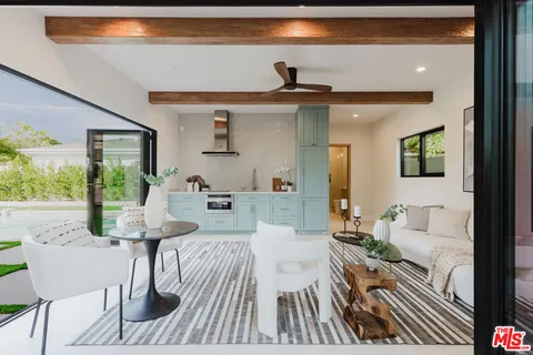 a living room with furniture and a table