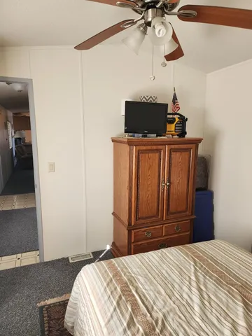 a bedroom with a bed and cabinets
