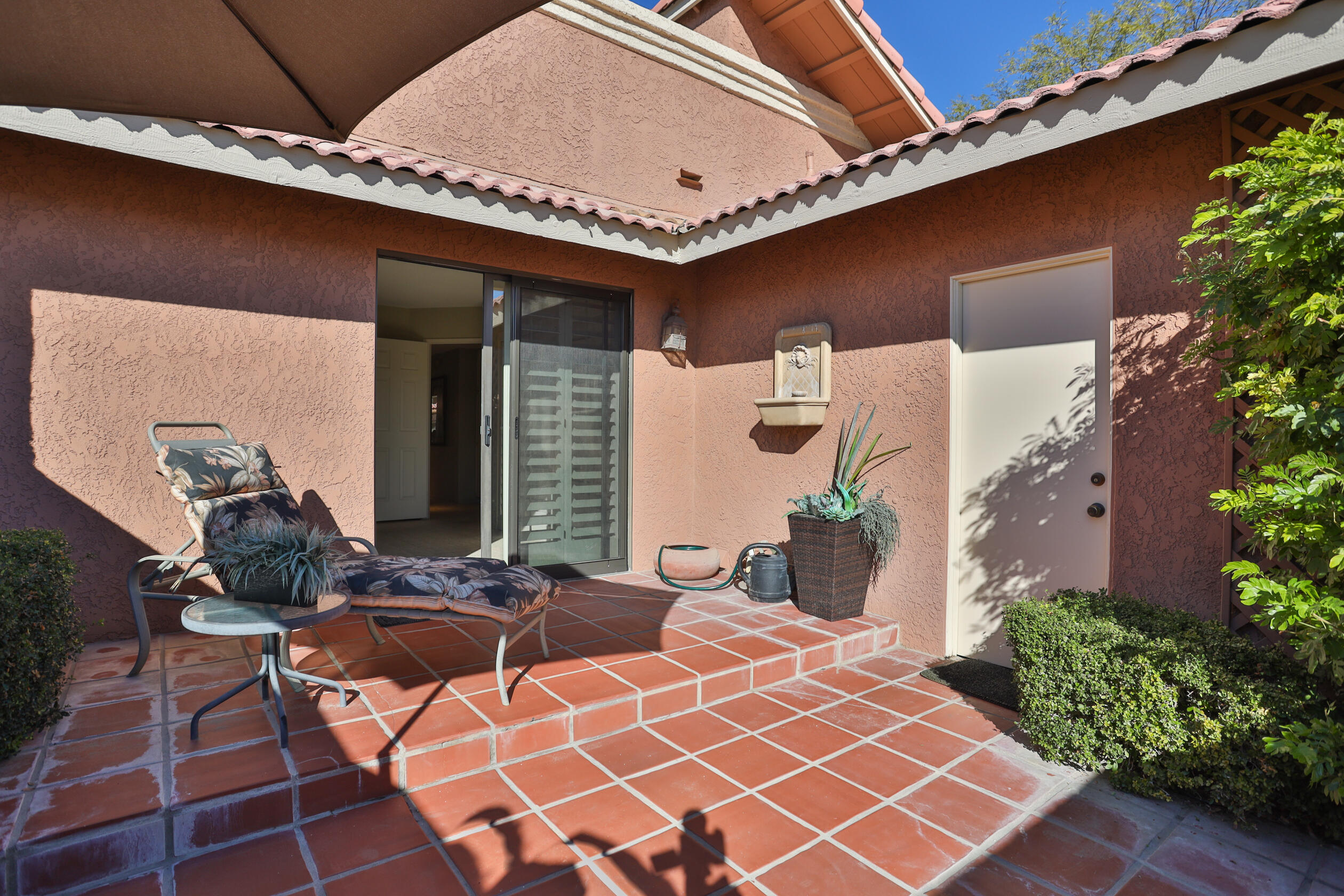 42895 Scirocco Road Palm Desert, CA 92211 - Photo 26 of 64 a backyard of a house with seating space