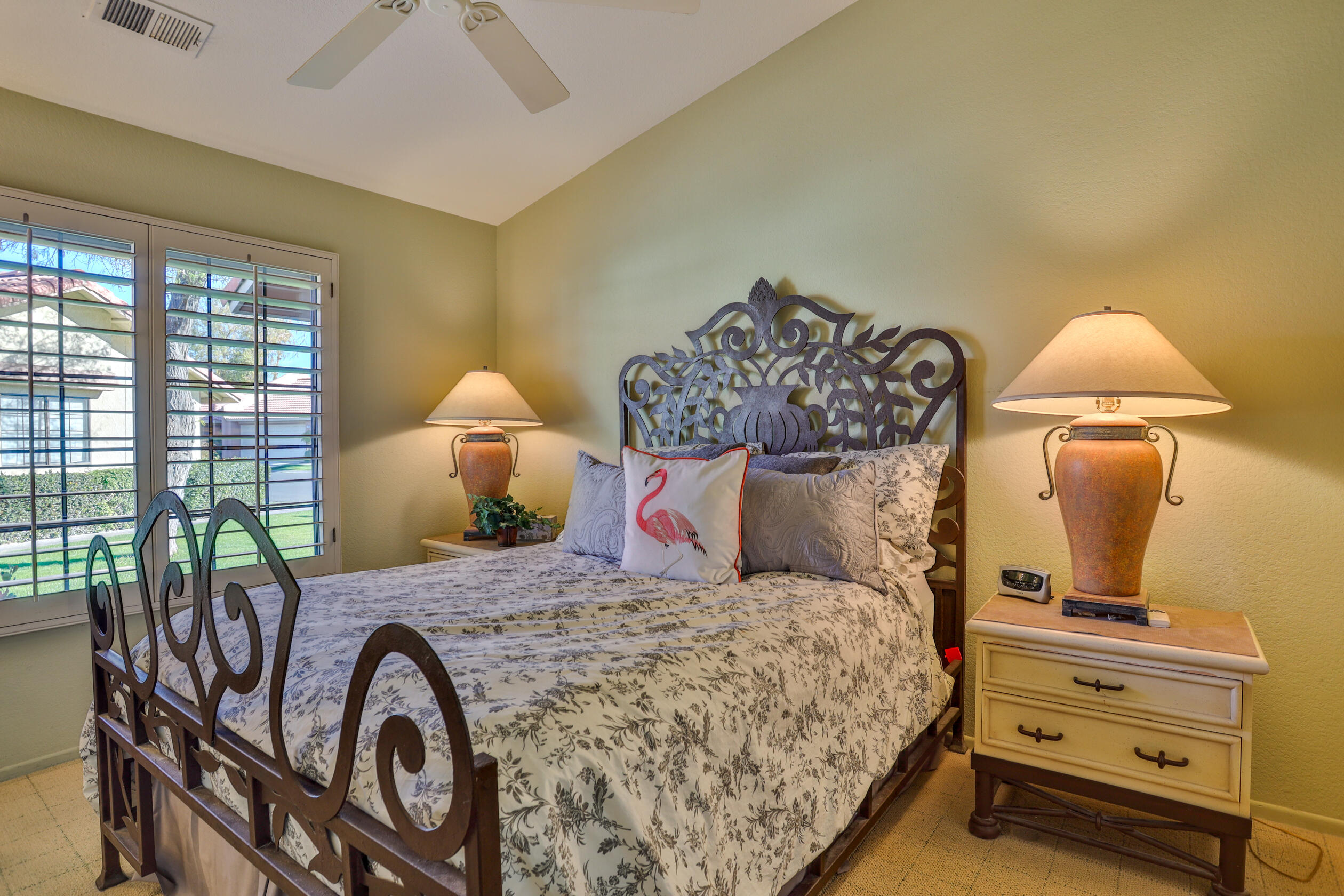 42895 Scirocco Road Palm Desert, CA 92211 - Photo 28 of 64 a bedroom with a bed and wooden floor